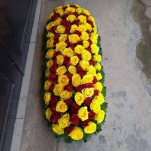 Serenity Farewell Casket Spray – Yellow & Red Rose Funeral Flowers | Kigali Delivery