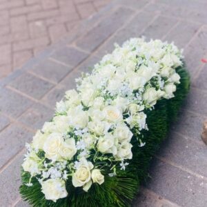 Peaceful Eternity White Rose Casket Spray – Funeral Flowers Kigali